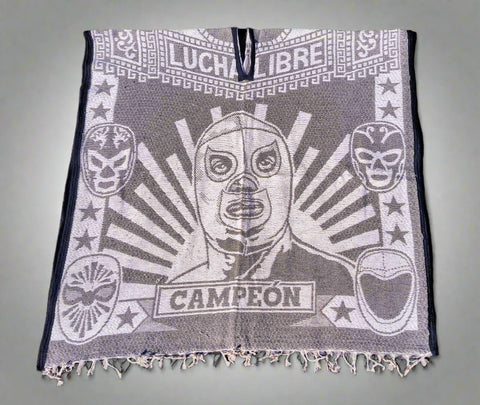 Luchador-themed towel with 'Campeon' text on a textured surface